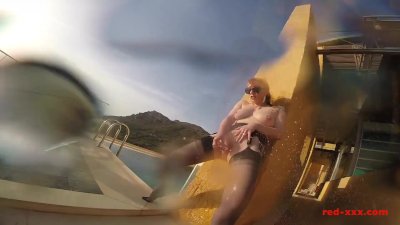 Sexy mature Red XXX masturbates outside by the pool